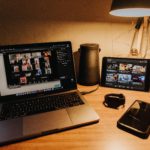 black and silver laptop computer on brown wooden table