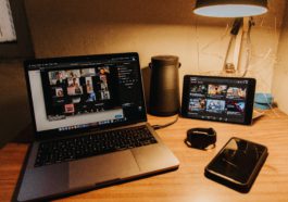 black and silver laptop computer on brown wooden table