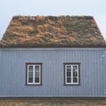 brown and gray house under blue sky