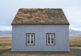 brown and gray house under blue sky