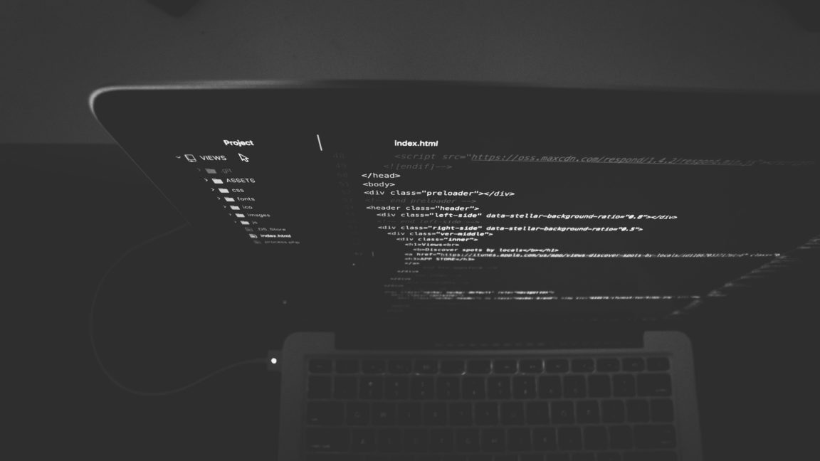 black and gray laptop displaying codes