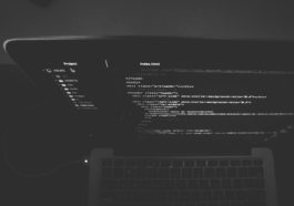 black and gray laptop displaying codes