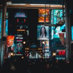 people walking on streets at nighttime