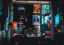 people walking on streets at nighttime