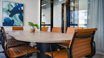 brown wooden 9-piece office table and chairs