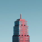 aerial photography of red and glass building