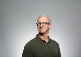 man wearing green polo shirt
