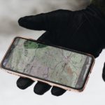 person holding iphone 6 with case