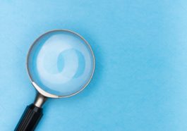 magnifying glass on white table